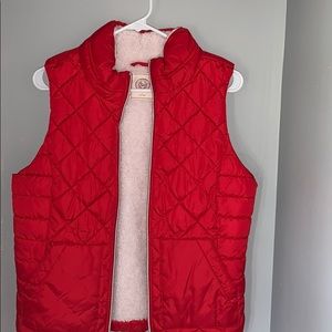 red puffer vest